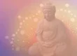 Serene Buddha statue with a pastel lotus background.